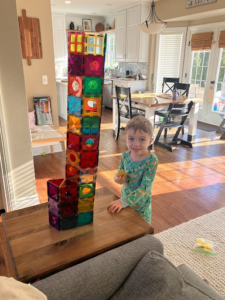 Alyssa's son playing with a set of Magna Tiles