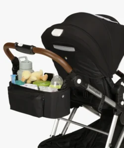 The parent organizer attachment with a water bottle, toys, and other essentials in it.