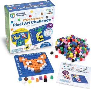 A deconstructed view of the Pixel Art Challenge. There is a pre-made pixel art creation next to a pile of cubes and an instruction manual. Behind the creation is a box set titled "Learning Resources STEM Explorers Pixel Art Challenge"