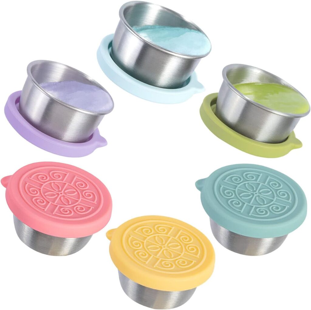 Colorful silicone lids over stainless steel dessert cups, ideal for serving and storing ice creams or snacks.