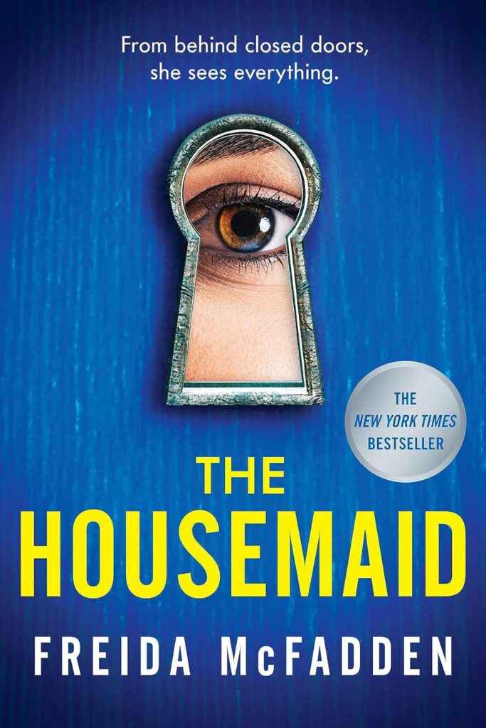 Cover of 'The Housemaid' by Frieda McFadden, featuring an eye peering through a keyhole on a blue background.