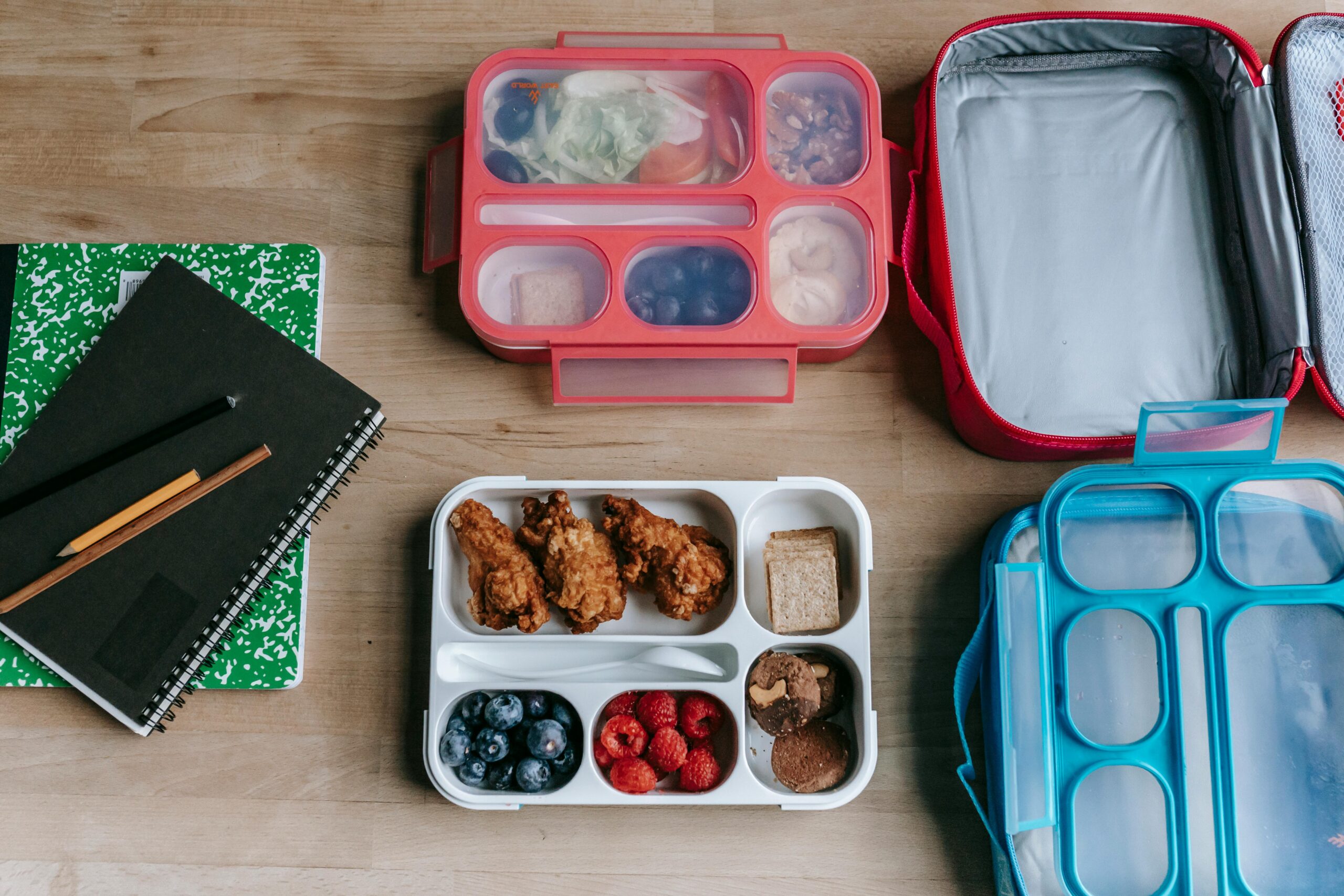 Bento lunch boxes spread out over dining room table