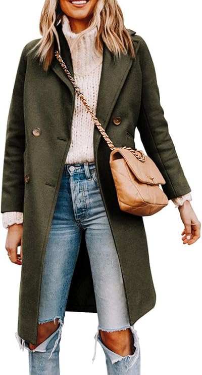 Woman in a stylish olive green coat, cream sweater, and ripped jeans, holding a chic tan handbag.