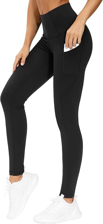 High-waisted black leggings with pockets, styled with white athletic shoes for a chic workout look.