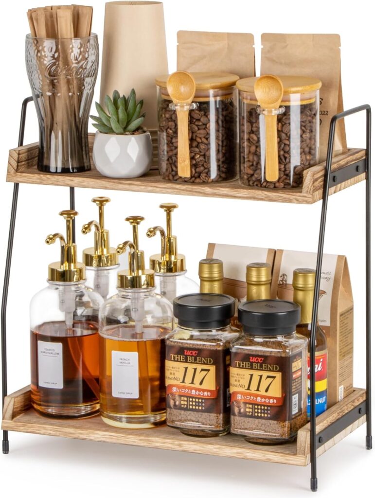 Stylish two-tier coffee station organizer with jars, syrups, and coffee blends for home or café use.