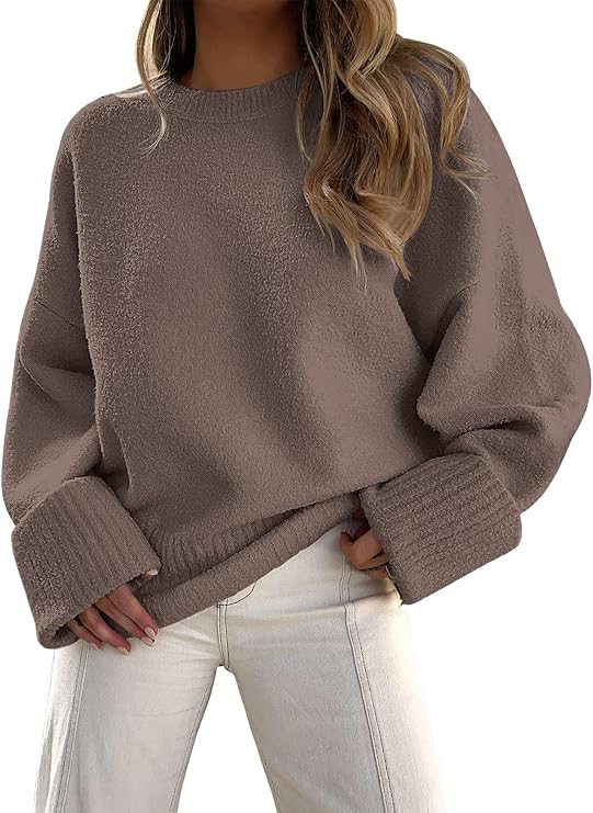 Cozy brown oversized sweater with long sleeves styled with light jeans, perfect for casual fall outfits.