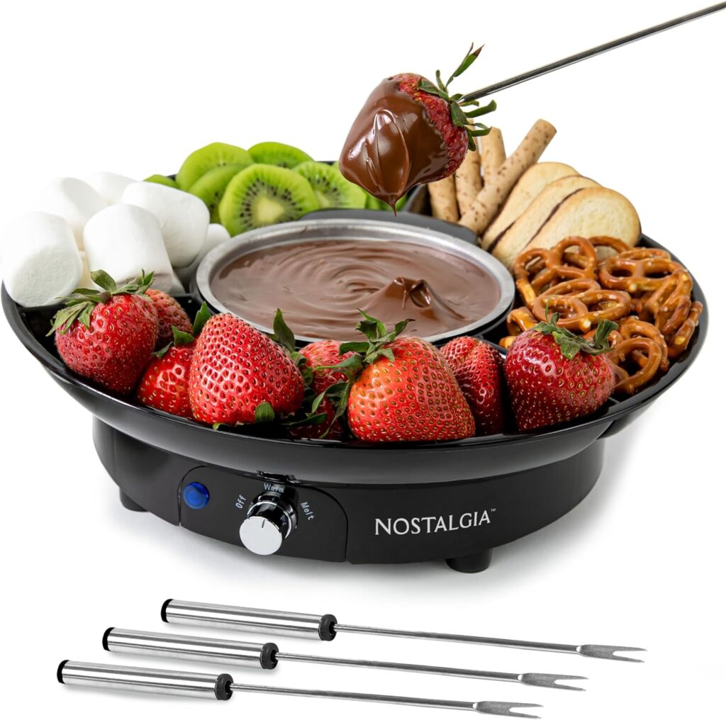 A chocolate fondue set with fresh strawberries, marshmallows, pretzels, and kiwi, featuring stainless steel skewers.
