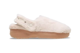 Cozy white fur clogs with a lightweight sole and adjustable strap for comfort and style.
