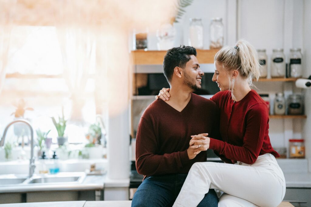 Couple in Kitchen enjoying an at-home date night.