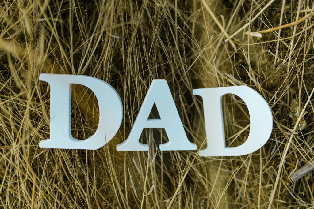 Father's Day DAD sign in the grass.