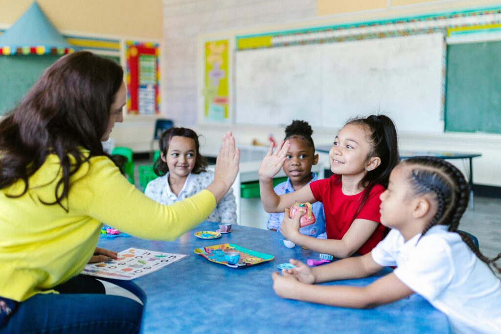 Teacher Appreciation, Kids and teacher doing crafts at a table.