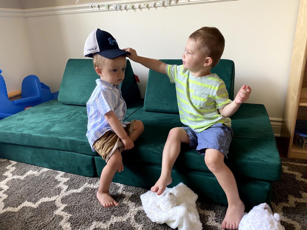 Toddler boys playing on Nugget play couch