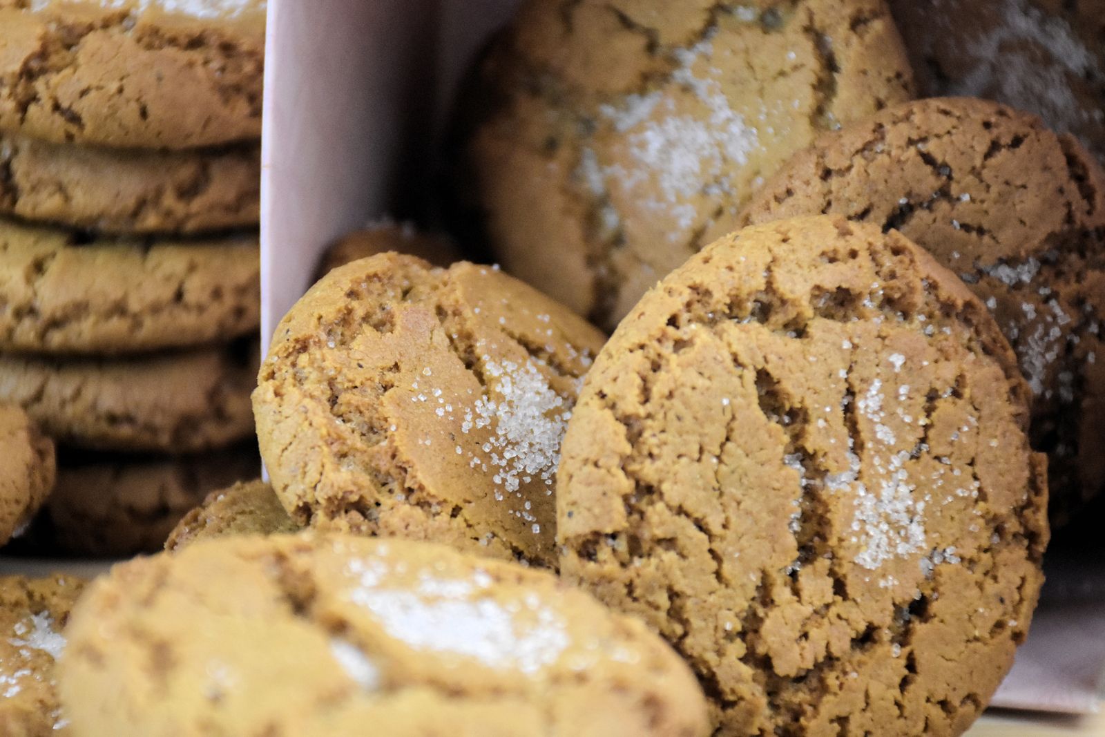 Snickerdoodle cookies with crackly sugar tops stacked close together