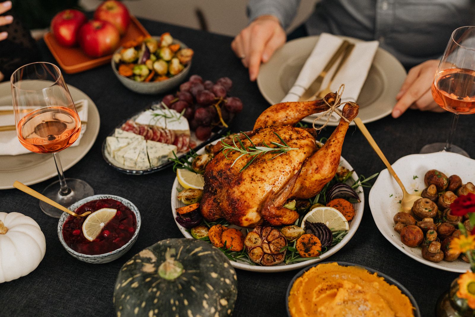 Thanksgiving table being served, dishes passed around